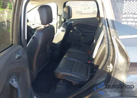 2016 Ford Escape Titanium z USA, uszkodzony, nr VIN 1FMCU9J90GUC55507